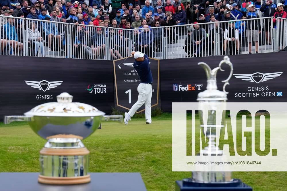 Mandatory Credit: Photo by Stuart Wallace Shutterstock (14003901a) Tom Kim (KOR) plays his tee shot on the 1st hole during the final round, flanked by the Genesis Scottish Open trophy and the Claret Jug. Genesis Scottish Open, Day Four, Golf, The Renaissance Club, North Berwick, UK - 16 Jul 2023 Genesis Scottish Open, Day Four, Golf, The Renaissance Club, North Berwick, UK - 16 Jul 2023