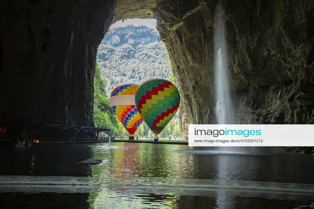 KW34 ENSHI, CHINA - AUGUST 17: Hot air balloons are seen in the Tenglong Cave on August 17, 2020 in Enshi Tujia and Miao Autonomous Prefecture, Hubei Province of China.
