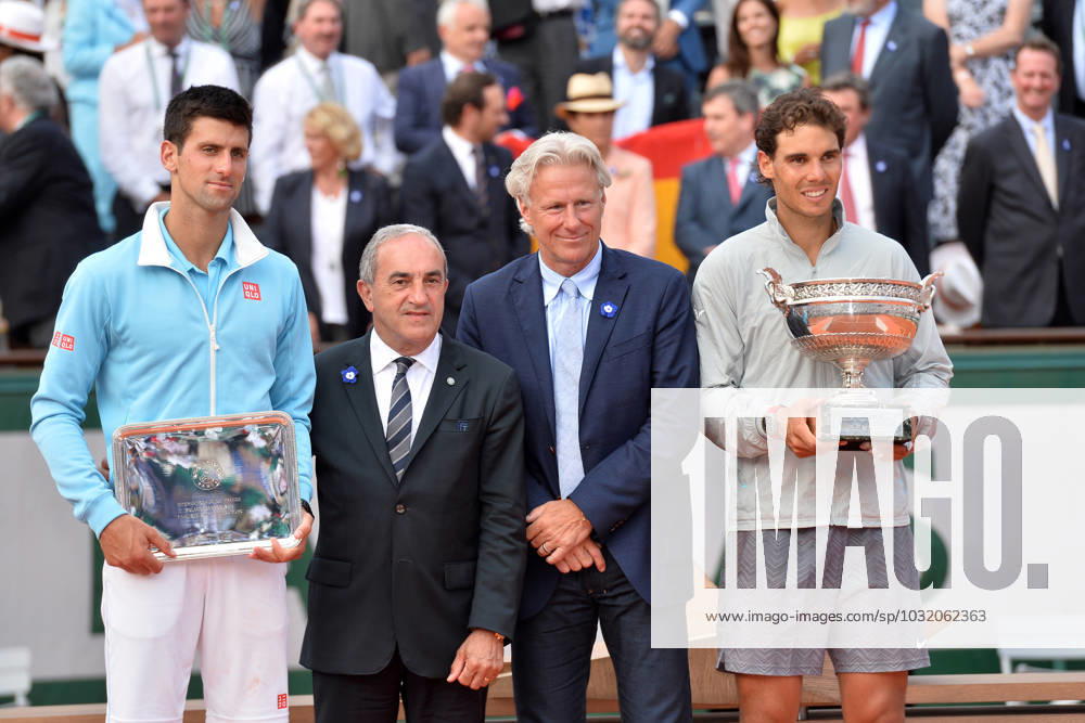 Roland Garros - Rafael Nadal Wins Title - Paris Rafael Nadal of Spain is presented with the Coupe des Mousquetaires by Bjorn Borg after his men s singles final match against Novak Djokovic of Serbia on day fifteen of the French Open at Roland Garros on June 8, 2014 in Paris, France. Photo by Laurent Zabulon ABACAPRESS.COM Paris France