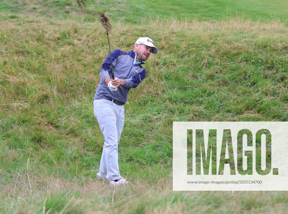 American Brian Harman hits out of the rough on the eleventh hole on the third day at the 151st Open Championship at Royal Liverpool Golf Club in Hoylake, England on Saturday, July 22, 2023. LON2023072238 HUGOxPHILPOTT