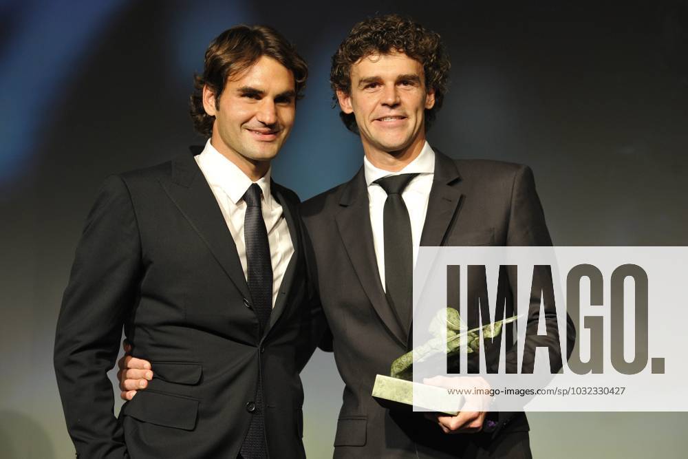 Tennis File Pictures Roger Federer of Switzerland and Gustavo Kuerten of Brazil at the ITF World Champions Dinner on day ten of the French Open tennis at the Roland Garros stadium in Paris, France on June 1, 2010. Photo by Corinne Dubreuil Cameleon ABACAPRESS.COM Paris - France