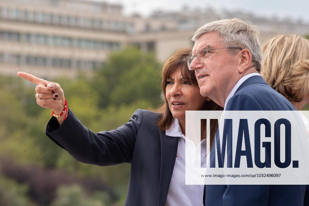 (230726) -- PARIS, July 26, 2023 -- International Olympic Committee (IOC) President Thomas Bach (R) and Paris Mayor Anne Hidalgo attend the torch presentation on a quay of the river Seine in Paris, France, on July 25, 2023. (Photo by Xinhua) (SP)FRANCE-PARIS-OLYMPICS-TORCH JulienxMattia