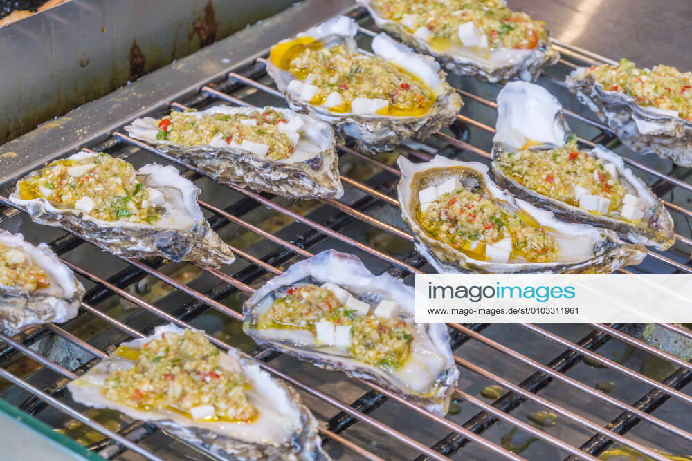 Chinese snack roasted oysters close-up 634041042441207829