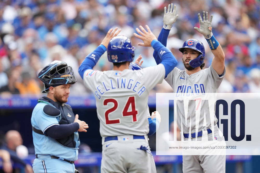 Toronto Blue Jays catcher Alejandro Kirk looks on as Chicago Cubs shortstop Dansby Swanson (7) celebrates after hitting a three run homer with teammate Cody Bellinger (24) during fourth inning MLB, Baseball Herren, USA interleague baseball action against the Toronto Blue Jays, in Toronto, Saturday, Aug. 12, 2023. Chicago Cubs Dansby Swanson; Cody Bellinger; Alejandro Kirk - ZUMAc35_ 20230812_zaf_c35_047