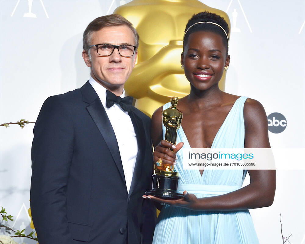 Christoph Waltz and Lupita Nyong o pose in the press room during the Oscars at Loews Hollywood Hotel. Hollywood USA - ZUMAb173 20140302_zap_b173_022