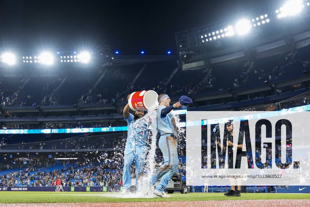 Toronto Blue Jays catcher Danny Jansen (9) is doused by teammate first baseman Vladimir Guerrero Jr. (27) after defeating the Washington Nationals in MLB, Baseball Herren, USA interleague baseball action in Toronto on Monday, August 28, 2023. Canada News - August 28, 2023 - ZUMAc35_ 20230828_zaf_c35_060