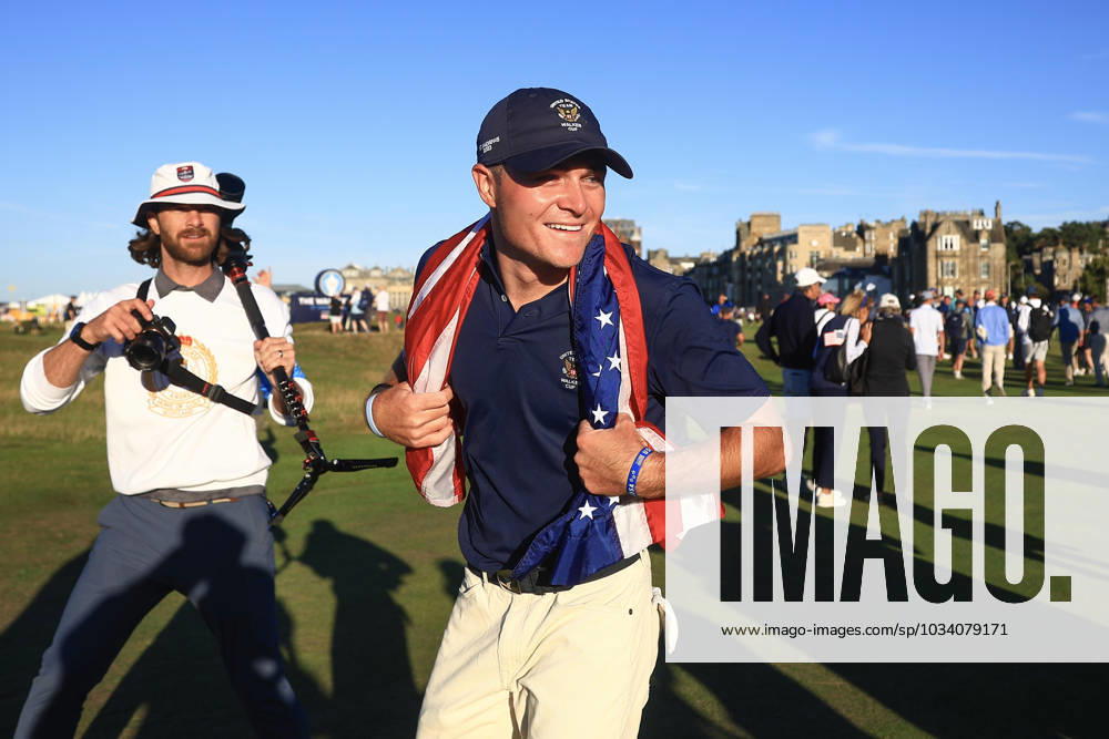 3rd September 2023; Old Course at St Andrews, St Andrews, Fife, Scotland; Walker Cup, Final Round; Austin Greaser of the United States of America celebrates with an American flag after securing the point which retained the Walker Cup for the USA ActionPlus12550604 DavidxYoung