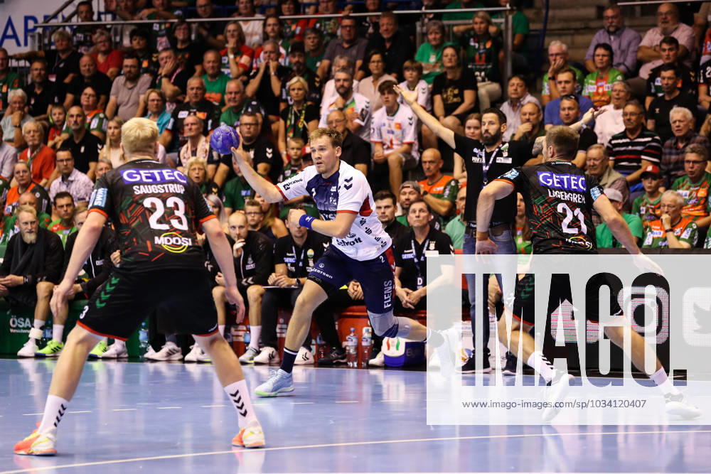 Simon Pytlick SG Flensburg Handewitt,2 vs Magnus Saugstrup SC Magdeburg,23 and Albin Lagergren SC Magdeburg,21 Handball Bundesliga Season 2023 2024 SC Magdeburg vs SG Flensburg Handewitt at GETEC Arena in Magdeburg Action,Handball,Germany