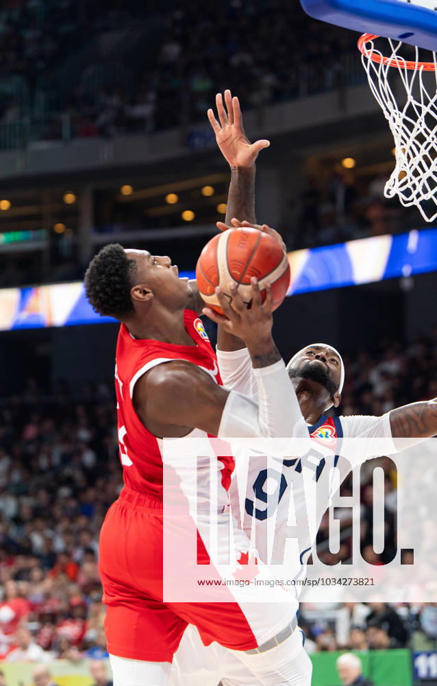 FIBA World Cup Basketball 3rd 4th playoff U.S.A. vs Canada at the Mall of Asia Arena Manila Philippines. Canadas RJ BARRETT is stopped from scoring by USAs Bobby PORTIS Jr. Manila Philippines - ZUMAr144 20230910_zap_r144_009