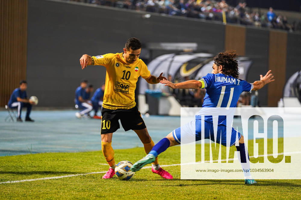 Iraq s Al-Quwa Al-Jawiya (Air Force)?? Iran s Sepahan - AFC Champions League in Erbil, Iraq - 18 Sep 2023 Jawiya s player 11 Humam Tareq (R) and Sepahan s player 10 Farshad Ahmadzadeh (L) compete for the ball during the first round of the AFC Champions League group stage matches between Iraq s Al-Quwa Al-Jawiya (Air Force) and Iran s Sepahan in Franso Hariri stadium in Erbil city, the capital of Iraq s northern autonomous Kurdistan region. Final score 2-2 Erbil Iraq