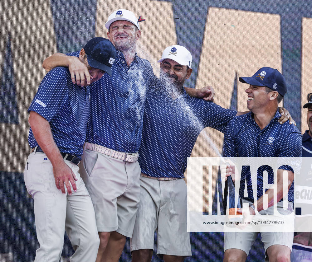 Paul Casey of England (R) sprays his teammages Charles Howell III of the US (L) Bryson DeChambeau of the US (2 L) and Anirban Lahiri of India (2R) after they won the team competition of the 2023 LIV Golf League tournament at Rich Harvest Farms in Sugar Grove, Illinois, on Sunday, September 24, 2023. Tournament play runs from September 22nd through the 24th. SGI20230924835 TANNENxMAURY