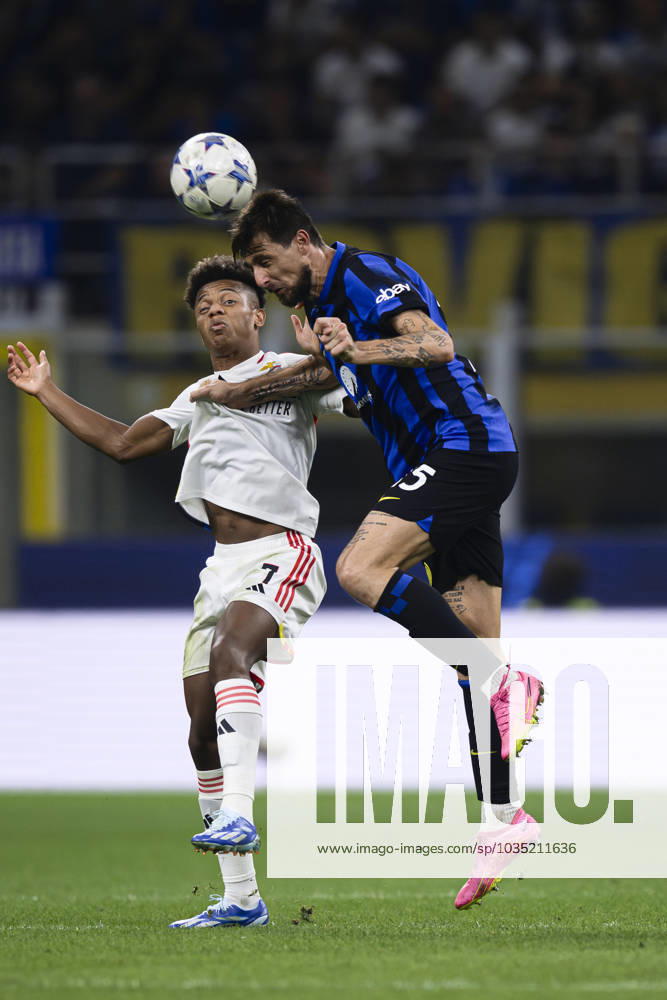 FC Internazionale v SL Benfica - UEFA Champions League Francesco Acerbi of FC Internazionale competes for a header with David Neres of SL Benfica during the UEFA Champions League football match between FC Internazionale and SL Benfica. Milan Italy