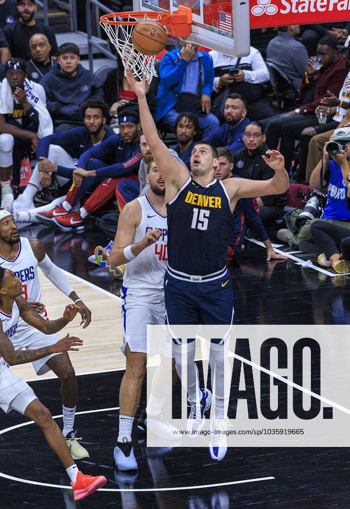 Nikola Jokic 15 of the Denver Nuggets grabs the rebound during their preseason NBA, Basketball Herren, USA game against the Los Angeles Clippers on Thursday October 19, 2023 at Crypto.com Arena in Los Angeles, California. ARIANA RUIZ PI Los Angeles USA - ZUMAp124 20231019_zaa_p124_006