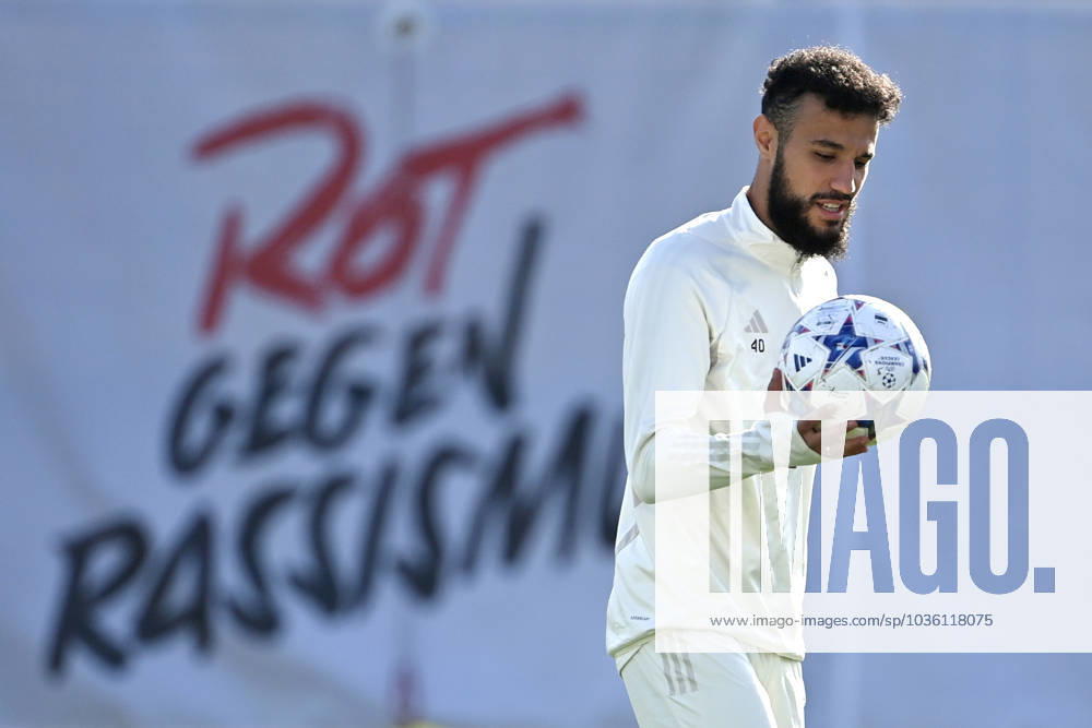 Noussair Mazraoui Bayern Muenchen in front of banner RED AGAINST RACISM action,single image,cropped single motif,half figure,half figure final training FC Bayern before the CL match against Galatasaray Istanbul on 23 10 2023,