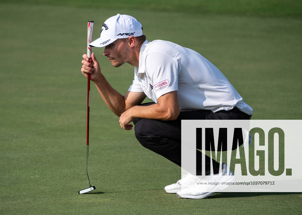 NICOLAI HoJGAARD of Denmark checks the 13th green during DP World Tour Championship in Dubai, United Arab Emirates, Nov 19, 2023. Dubai United Arab Emirates