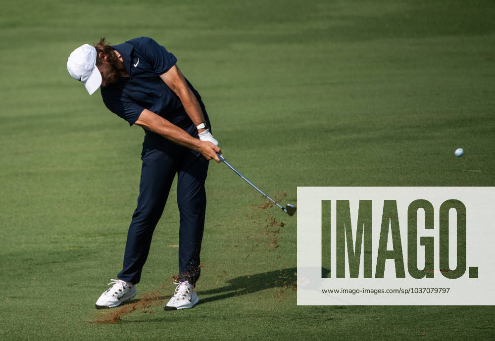 TOMMY FLEETWOOD of England strikes the ball on the fifth fairway during DP World Tour Championship in Dubai, United Arab Emirates, Nov 19, 2023. Dubai United Arab Emirates