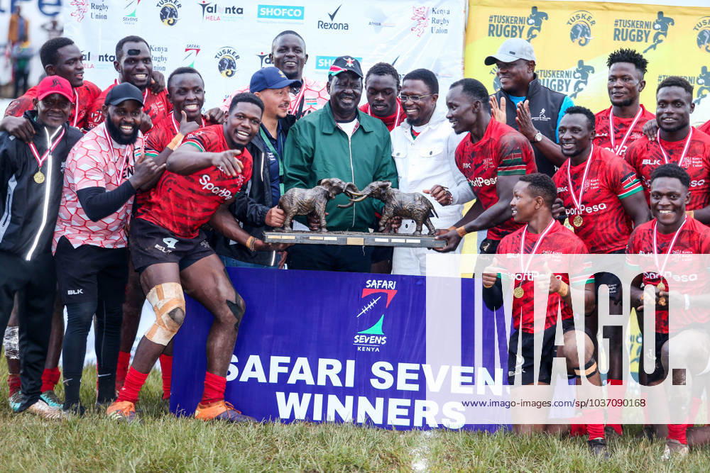 Kenya Shujaa Captain Vincent Onyala celebrates with teammates joined by Opposition leader Raila Odinga,Cs Ababu Namwamba and KRU chairman Sasha Mutai lifting Safari 7s rugby tournament, Trophy after defeating Samurai Barracudas 19-0, on November 19th 2023 at RFUEA ground.Photo CHRIS OMOLLO