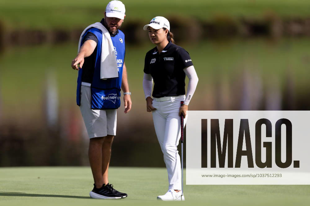 Minjee Lee and her caddie discuss the line of her putt during round 1 of The Australian Open Golf at The Lakes Golf Club on November 30, 2023 in Sydney, Australia. (Photo by Damian Briggs Speed Media Icon Sportswire) GOLF: NOV 30 Australian Open Icon23113001051