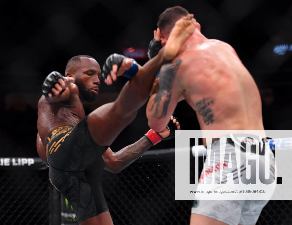 LEON EDWARDS (21-3-0) of Erdington, birmingham, England (L) defeats COLBY COVINGTON (17-3-0) of Miami, Florida USA (R) by a unanimous decision (49-46, 49-46, 49-46) during UFC 296 at T-Mobile Arena, Las Vegas Las Vegas USA - ZUMAo117 20231216_zsp_o117_053