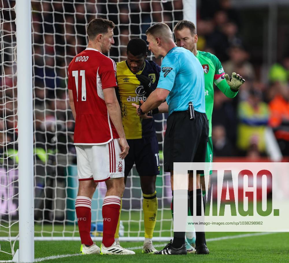 Nottingham Forest v Bournemouth Premier League Referee Rob Jones has a word with Chris Wood of Nottingham Forest and Dango Ouattara of Bournemouth during the Premier League match at the City Ground, Nottingham