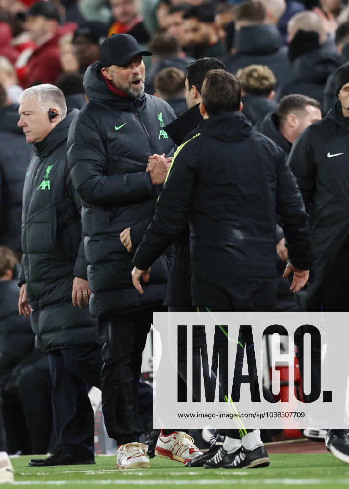 Liverpool, England, 23rd December 2023. Jurgen Klopp manager of Liverpool shakes hands with Mikel Arteta manager of Arsenal (hidden) during the Premier League match at Anfield, Liverpool. Picture credit should read: Darren Staples Sportimage . SPI-2829-0073