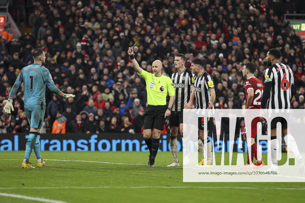 Football - 2023 2024 Premier League - Liverpool vs Newcastle United - Anfield - Monday 1st January 2024. Diogo Jota of Liverpool is brought down by Martin Dubravka of Newcastle United for a penalty and is booked by referee Anthony Taylor