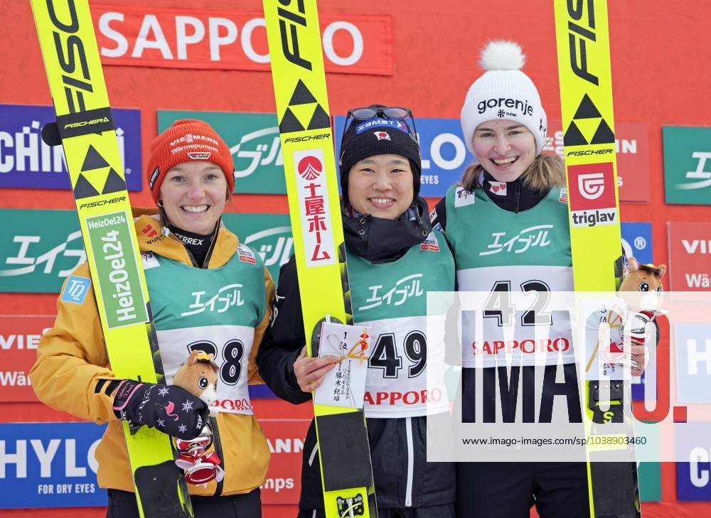 KW02 Ski jumping, Skispringen, Ski, nordisch World Cup in Sapporo Japan s Yuki Ito (C) poses for photos after winning a World Cup women s ski jumping meet in Sapporo in Hokkaido, northern Japan, on Jan. 14, 2024, alongside Germany s Katharina Schmid (L) and Slovenia s Nika Kriznar, who finished second and third, respectively. A14AA0002323725P