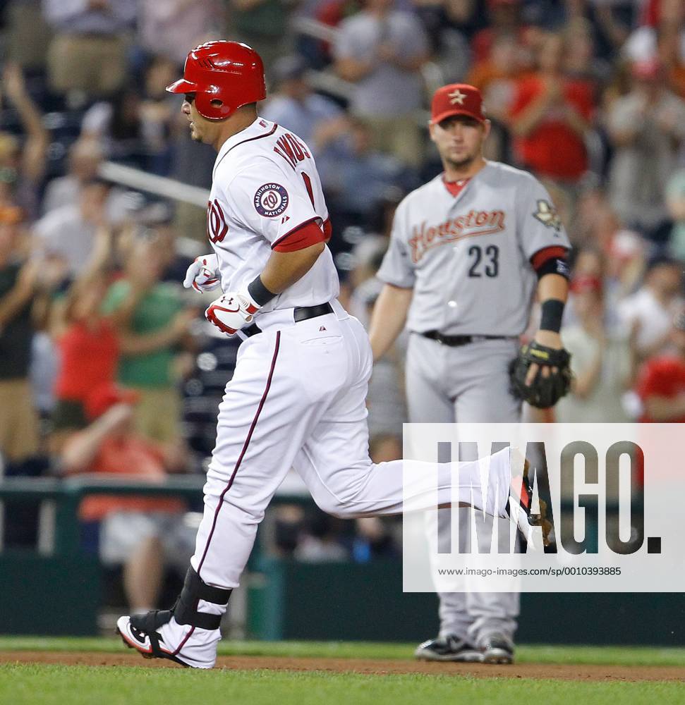 Washington, District of Columbia, U.S. - Washington Nationals catcher WILSON RAMOS (3) rounds the bases in front of Houston Astros third baseman CHRIS JOHNSON (23) after hitting a home run off Astros starting pitcher Kyle Weiland (56) during the fourth inning at Nationals Park. MLB Baseball Herren USA 2012 - Nationals Beat Astros 6-3 - ZUMAm67
