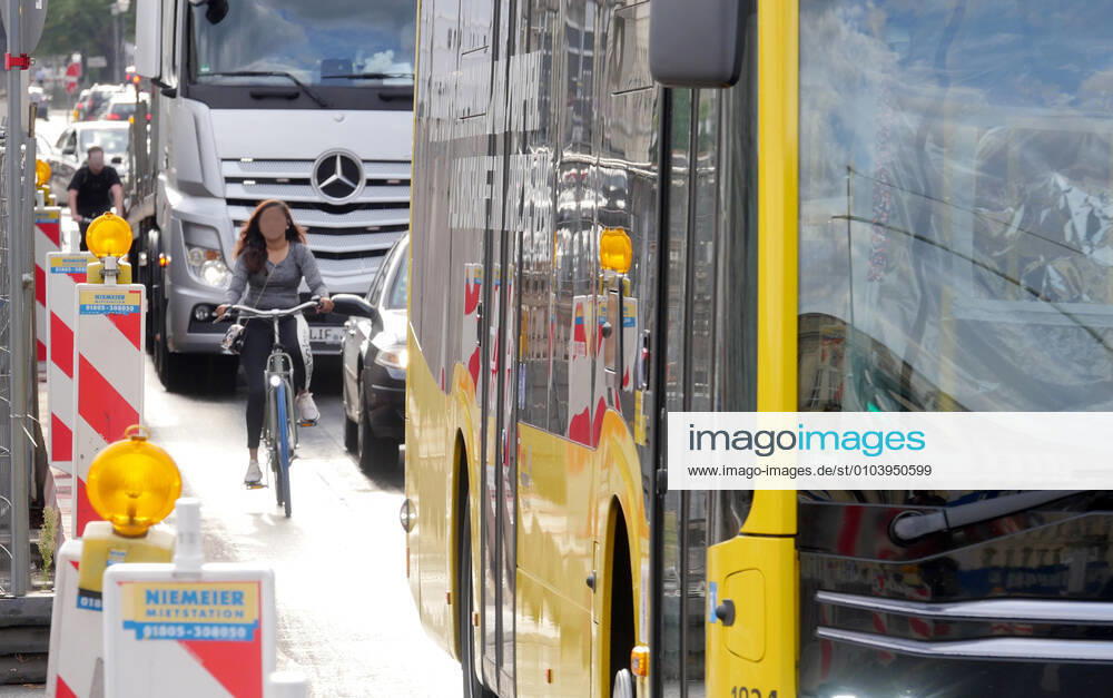Berlin Germany Dense traffic with buses, cars and trucks is a dangerous situation for people on the bike