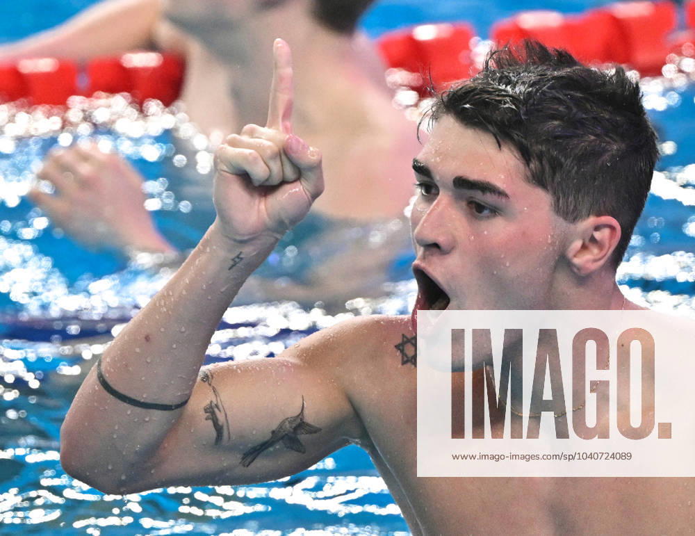 (240218) -- DOHA, Feb. 18, 2024 -- Diogo Matos Ribeiro of Portugal celebrates after the men s 100m butterfly final of swimming event at the World Aquatics Championships 2024 in Doha, Qatar, Feb. 17, 2024. ) (SP)QATAR-DOHA-SWIMMING-WORLD AQUATICS CHAMPIONSHIPS-MEN S 100M BUTTERFLY XiaxYifang