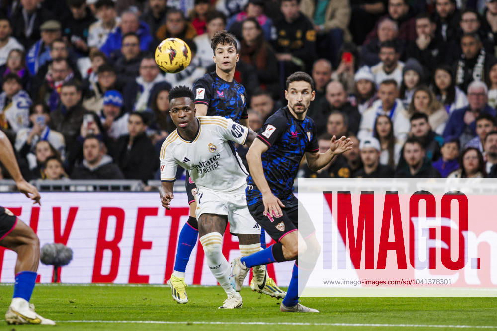 Real Madrid CF v Sevilla FC - LaLiga EA Sports Vinicius Junior of Real Madrid is battling for the ball with Jesus Navas of Sevilla FC during the LaLiga EA Sports match between Real Madrid and Sevilla at Santiago Bernabeu Stadium in Madrid, Spain, on February 25, 2024. Madrid Spain