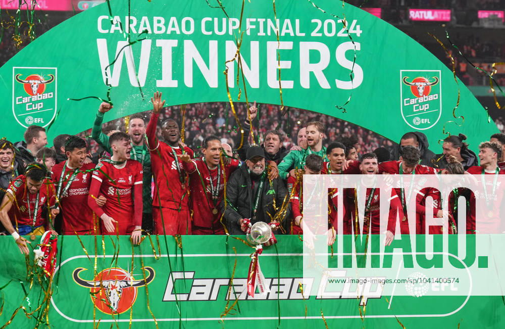 Liverpool manager Jurgen Klopp and his team celebrate with the winning trophy during the Carabao Cup final match between Chelsea and Liverpool at Stamford Bridge, London, England on 25 February 2024.