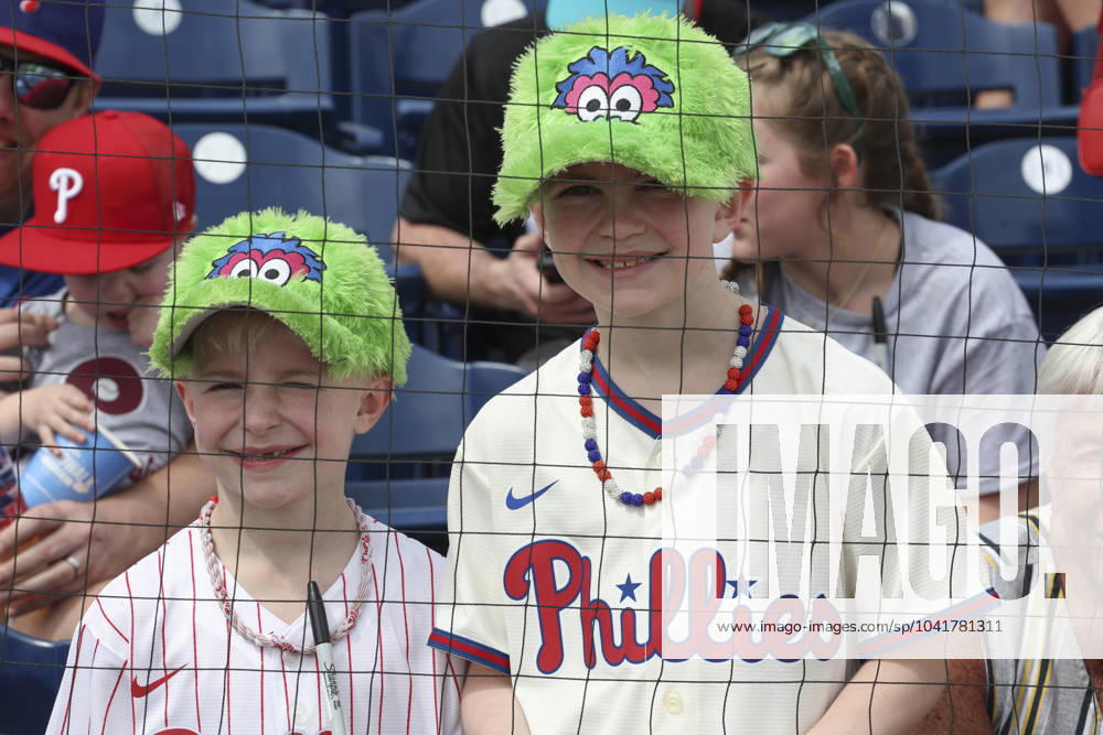 Two young Philadelphia Phillies fans with their FanaticÃ¢â‚¬â ¢s hats enjoy the day during an MLB, Baseball Herren, USA spring training game against the Miami Marlins on March 1, 2024 at BayCare Ballpark. The Phillies and Marlins played to a 6-6 tie. Clearwater USA - ZUMAh180 20240301_zsp_h180_001