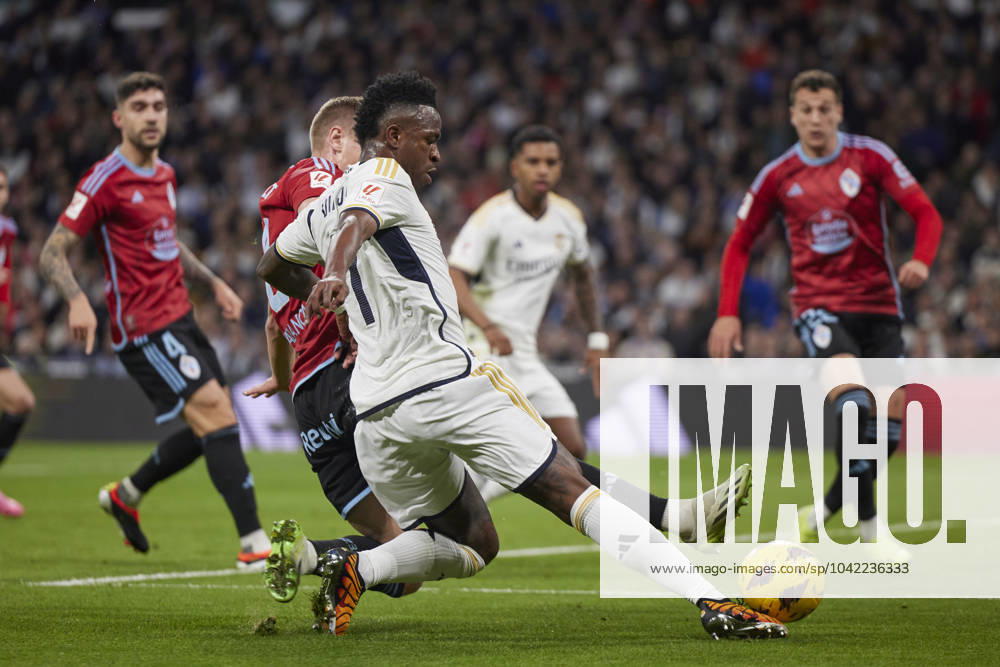 Vinicius Jr (Real Madrid CF) and Carl Starfelt (RC Celta) battle for the ball, La Liga EA Sports match round 28, Real Madrid v RC Celta de Vigo, Santiago Bernabeu Stadium, March 10, 2024, Madrid, Spain.