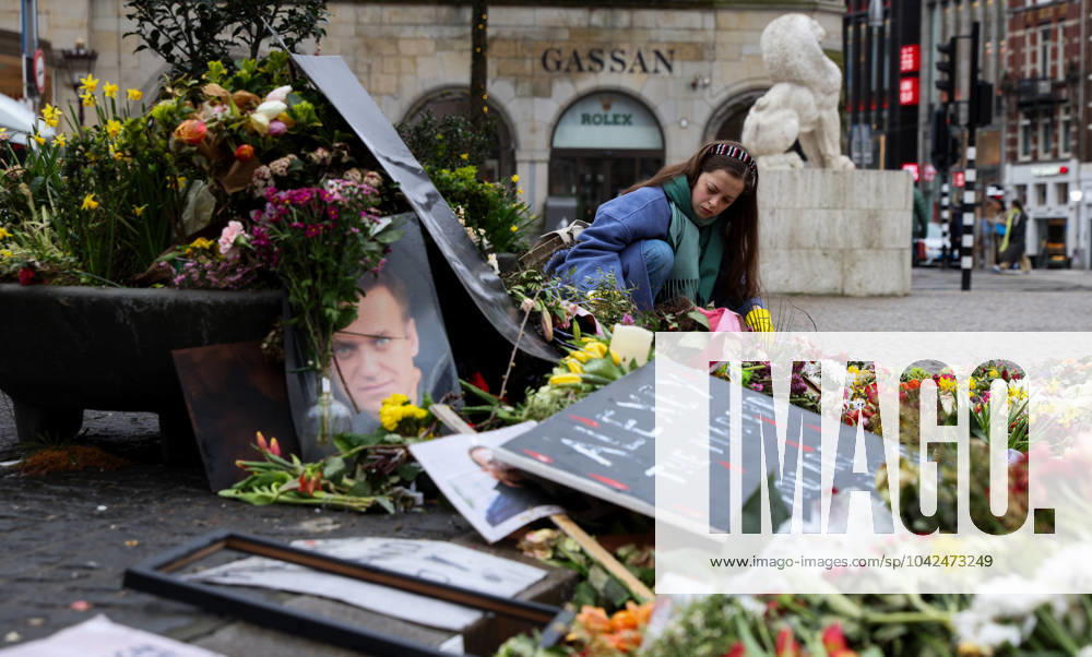 Flowers & memorial to Russian opposition leader Alexei Anatolyevich Navalny who died on February 16, 2024 lie in front of the National Monument on Dam Square Alexei Anatolyevich Navalny memorial & flowers, Dam Square, Amsterdam, Netherlands - 13 Mar 2024