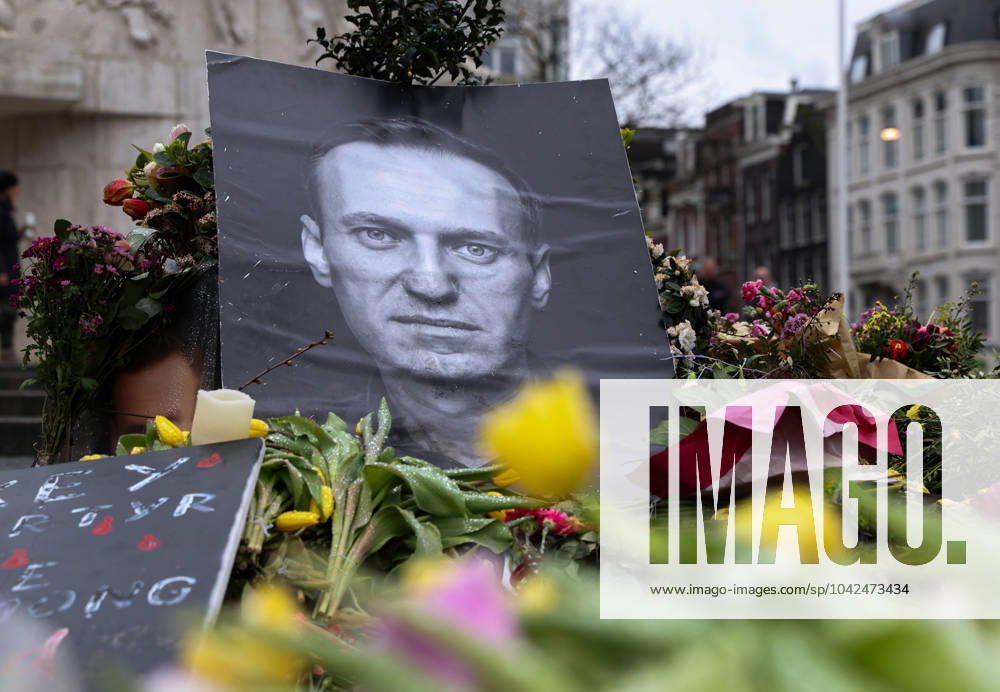 Flowers & memorial to Russian opposition leader Alexei Anatolyevich Navalny who died on February 16, 2024 lie in front of the National Monument on Dam Square Alexei Anatolyevich Navalny memorial & flowers, Dam Square, Amsterdam, Netherlands - 13 Mar 2024