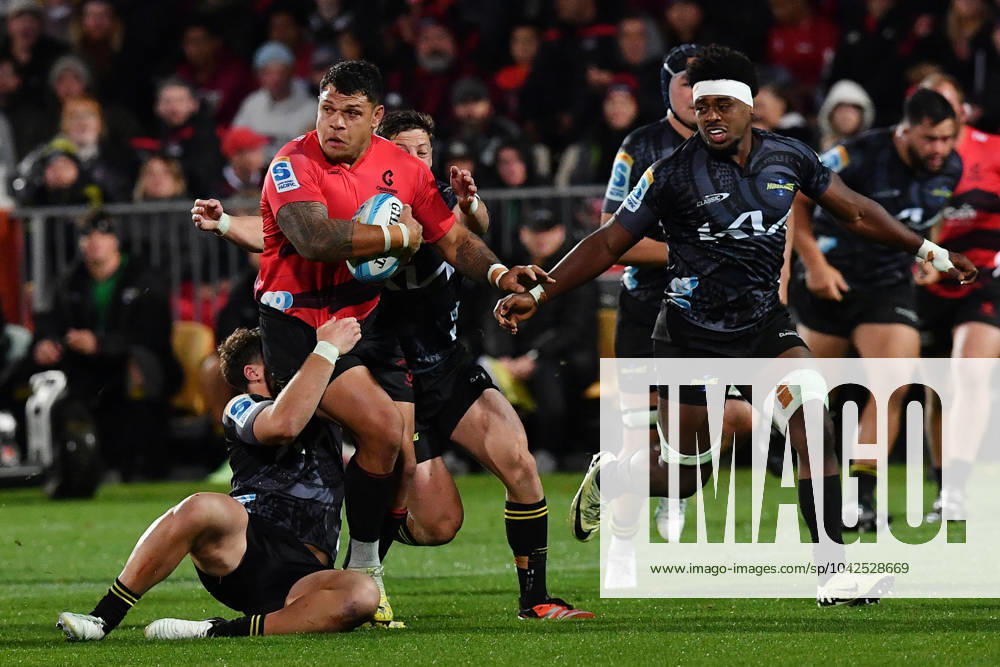 Super Rugby Pacific Round Four- Crusaders And Hurricanes Levi Aumua of the Crusaders (2nd L) is being tackled by the Hurricanes defense during the round four Super Rugby Pacific match between the Crusaders and the Hurricanes at Apollo Projects Stadium in Christchurch, New Zealand, on March 15, 2024. Christchurch New Zealand