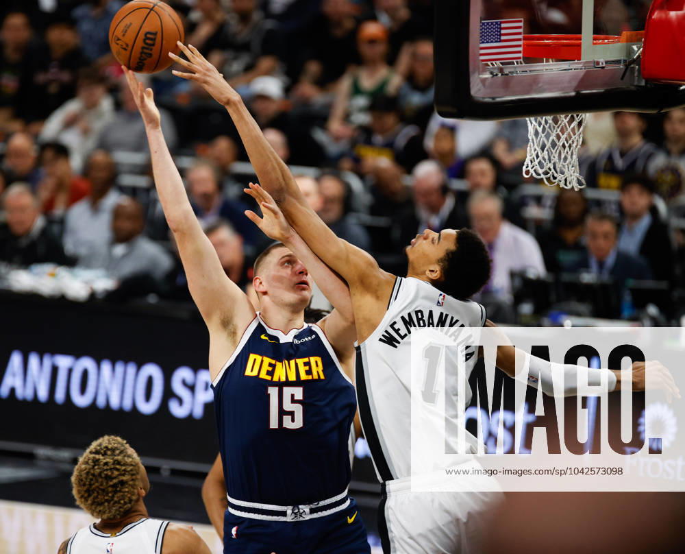Denver Nuggets center Nikola Jokic (15) shoots over San Antonio Spurs center Victor Wembanyama (1) during an NBA, Basketball Herren, USA game on March 15, 2024. - ZUMAc201 20240315_zap_c201_005