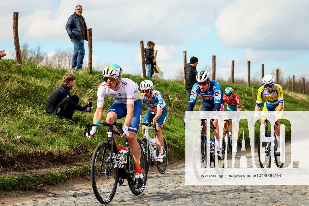 French Thomas Gachignard of TotalEnergies, German Niklas Markl of Team DSM-Firmenich PostNL, Danish Casper Pedersen of Soudal Quick-Step and Belgian Victor Vercouillie of Team Flanders Baloise pictured in action during the men elite race of the Dwars Door Vlaanderen cycling race, 188,6 km from Roeselare to Waregem, Wednesday 27 March 2024. DAVIDxPINTENS x89927474x