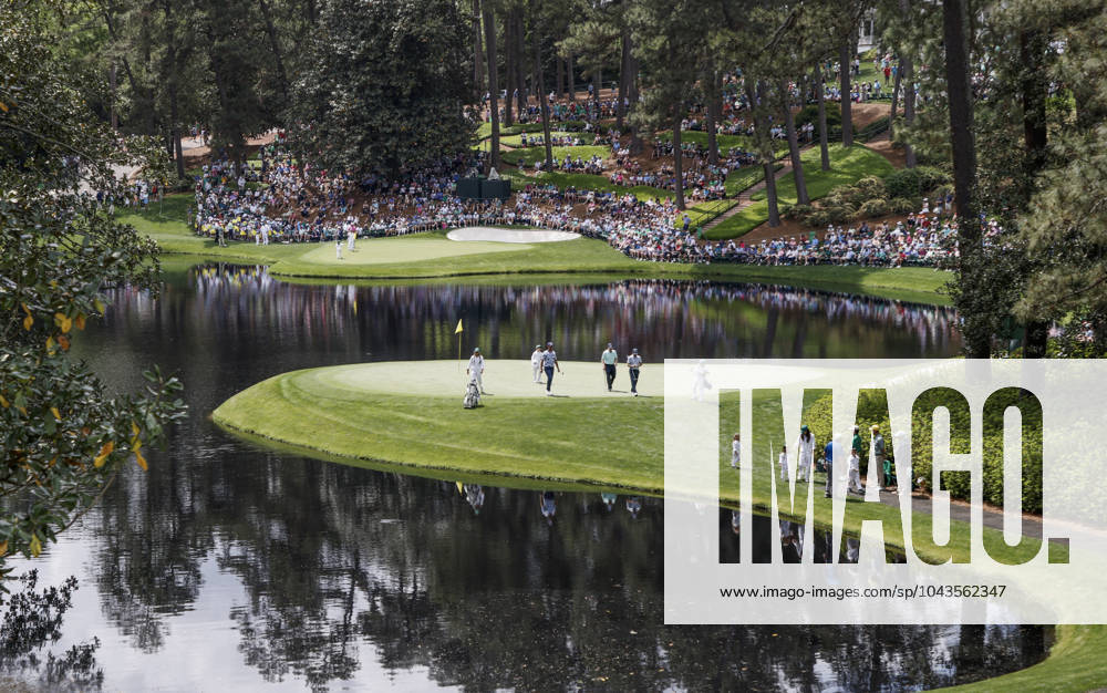 Golfers walk off the eighth green during the Par 3 contest at the Masters Tournament at Augusta National Golf Club in Augusta, Georgia on Wednesday, April 10, 2024. AUG20240410549 TANNENxMAURY