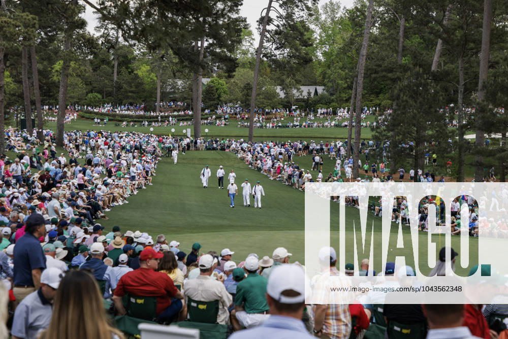 Golfers walk up the seventh fairway during the Par 3 contest at the Masters Tournament at Augusta National Golf Club in Augusta, Georgia on Wednesday, April 10, 2024. AUG20240410550 TANNENxMAURY