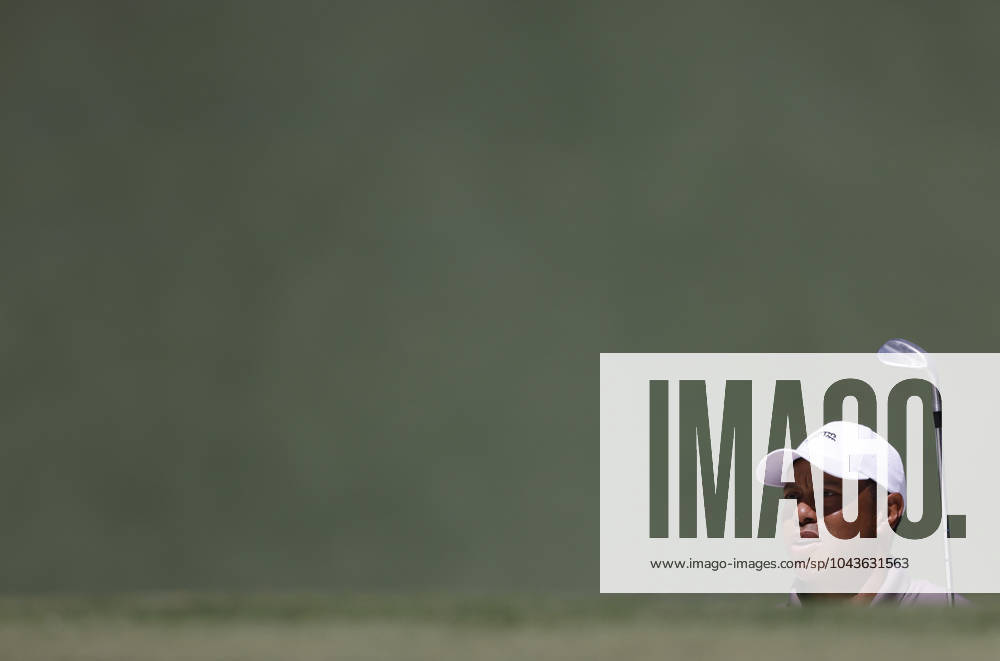 Tiger Woods watches his shot out of a bunker on the seventh green in the second round of the Masters Tournament at Augusta National Golf Club in Augusta, Georgia on Friday, April 12, 2024. AUG20240412526 TANNENxMAURY