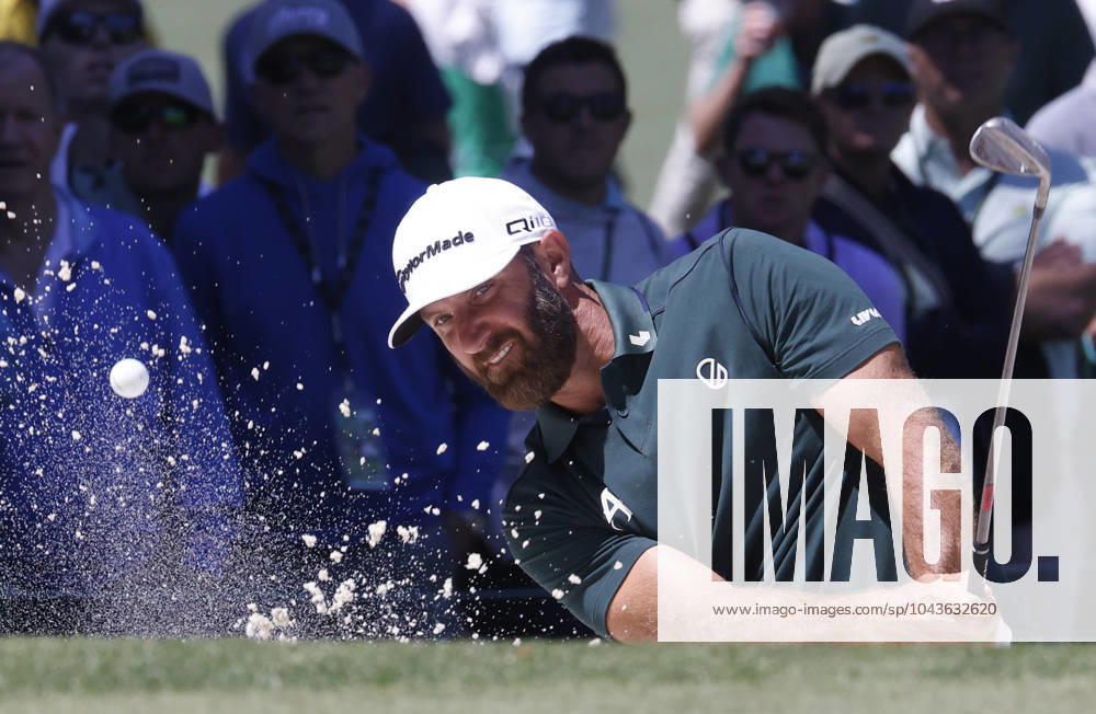 Dustin Johnson hits out of a bunker on the seventh hole in the second round of the Masters Tournament at Augusta National Golf Club in Augusta, Georgia on Friday, April 12, 2024. AUG20240412539 TANNENxMAURY