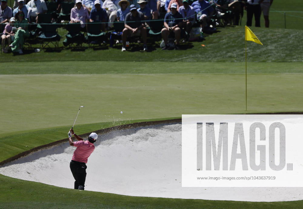 Japan s Hideki Matsuyama plays out of a bunker on the fourth hole in the second round of the Masters Tournament at Augusta National Golf Club in Augusta, Georgia on Friday, April 12, 2024. AUG202404125674 TANNENxMAURY
