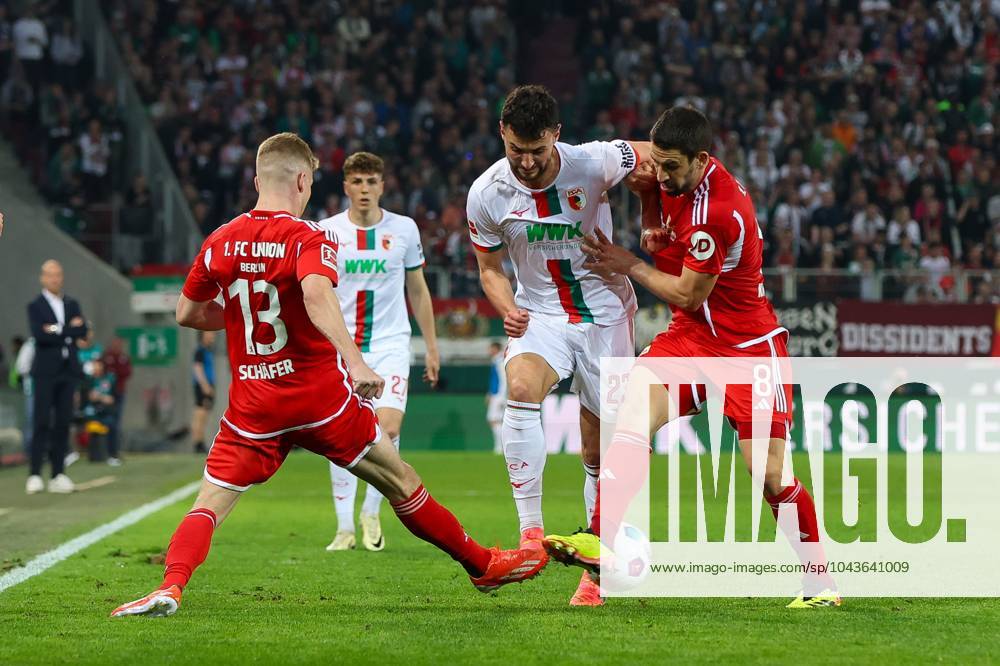 In duel, action, with Andras Schaefer 13 1 FC Union Berlin , Maximilian Bauer 23 FC Augsburg , Rani Khedira 8 1 FC Union Berlin , FC Augsburg vs 1 FC Union Berlin, Football, 1 Bundesliga, Matchday 29, 13 04 2024 DFB regulations prohibit any use of photographs as image sequences and or quasi video Augsburg Bayern Germany