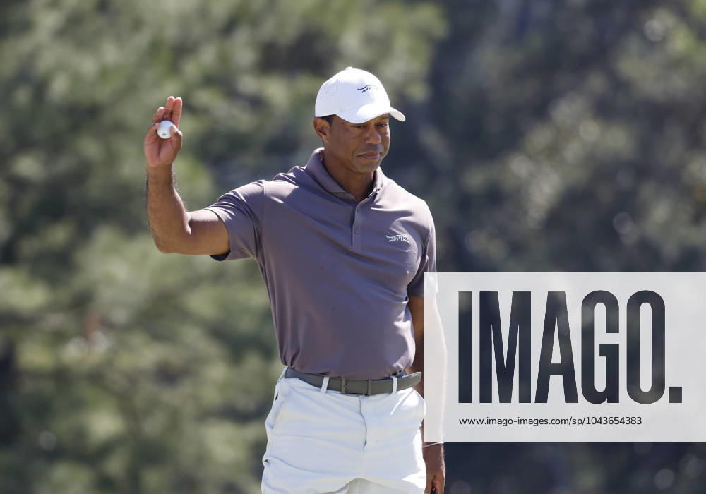 Tiger Woods hugs Jason Day on the eighteenth green in the second round of the Masters Tournament at Augusta National Golf Club in Augusta, Georgia on Friday, April 12, 2024. Tiger Woods set a Masters record with his 24th straight made cut at Augusta National. AUG20240412144 JOHNxANGELILLO