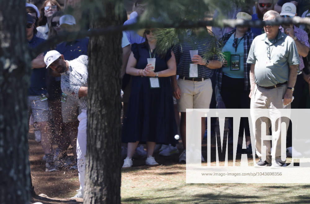 South Africa s Erik van Rooyen hits from behind a tree on the seventh hole during the third round of the Masters Tournament at Augusta National Golf Club in Augusta, Georgia on Saturday, April 13, 2024. AUG20240413503 TANNENxMAURY
