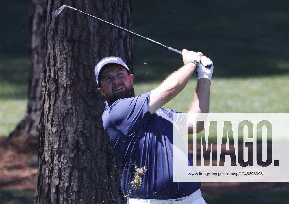 Ireland s Shane Lowry hits an approach shot on the seventh hole during the third round of the Masters Tournament at Augusta National Golf Club in Augusta, Georgia on Saturday, April 13, 2024. AUG20240413505 TANNENxMAURY
