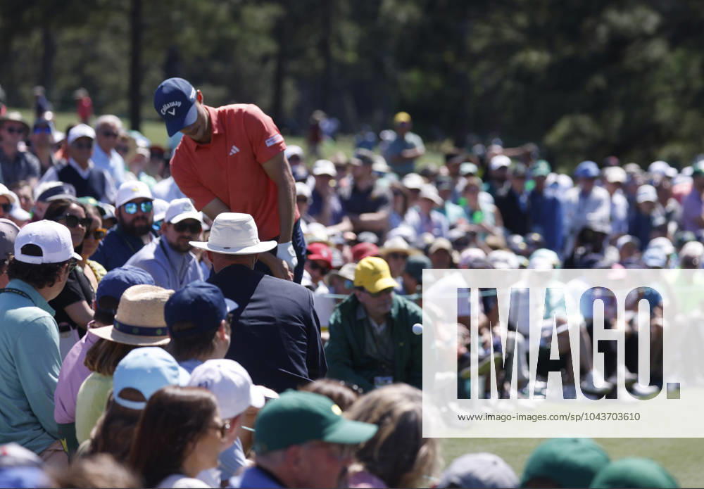 Denmark s Nicolai Hojgaard hits out of the crowd on the second hole during the third round of the Masters Tournament at Augusta National Golf Club in Augusta, Georgia on Saturday, April 13, 2024. AUG20240413520 TANNENxMAURY