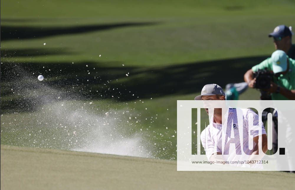 Bryson DeChambeau hits out of a bunker on the seventh hole during the third round of the Masters Tournament at Augusta National Golf Club in Augusta, Georgia on Saturday, April 13, 2024. AUG20240413537 TANNENxMAURY
